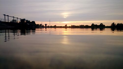 Reflection of clouds in water at sunset