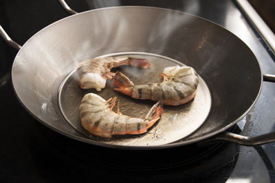 High angle view of meat in cooking pan