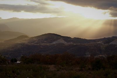 Scenic view of mountains against sky during sunset