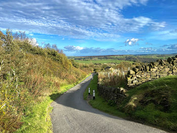 View along, shaws lane, of countryside near, sowerby bridge, yorkshire, uk