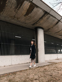 Full length of woman standing in building