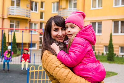 Portrait of smiling young woman outdoors