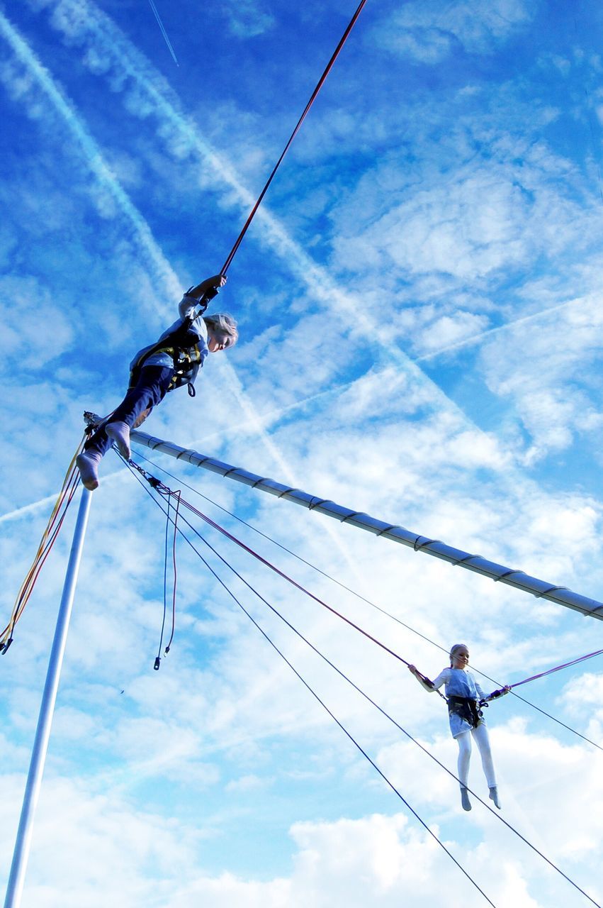 sky, real people, one person, low angle view, cloud - sky, hanging, men, outdoors, day, one man only, only men, adults only, people, adult