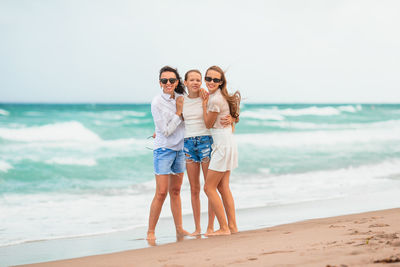 Full length of woman standing at beach