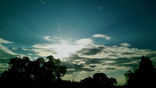 Sun shining through clouds