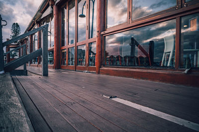 Empty seats by railing against sky