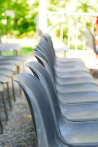 Close-up of empty chairs in park