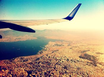 Cropped image of airplane flying over landscape