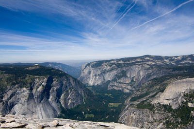 Scenic view of mountains against cloudy sky