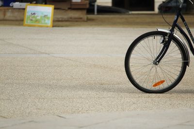Bicycle parked on road