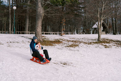 Man skiing on snow covered field