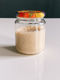 Close-up of drink in glass jar on table