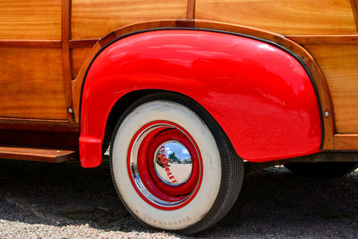 Close-up of red vintage car on street