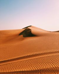 Scenic view of desert against clear sky