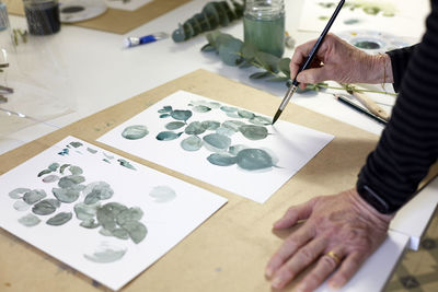 High angle view of person working on table