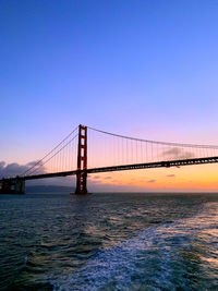 View of suspension bridge over sea