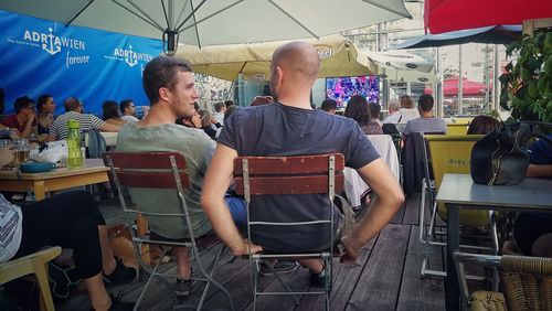 People sitting in restaurant at market