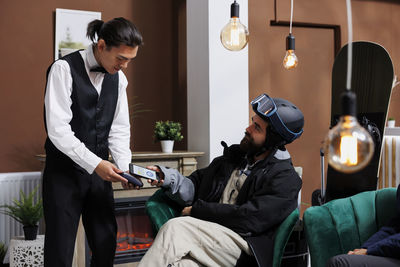 Side view of man working in office