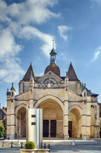 Facade of historic building against sky