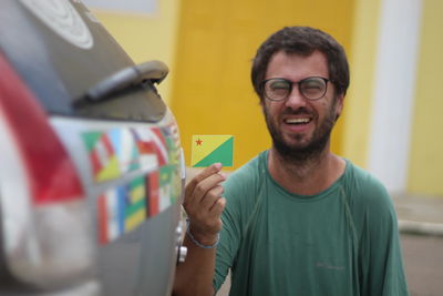 Portrait of young man using mobile phone