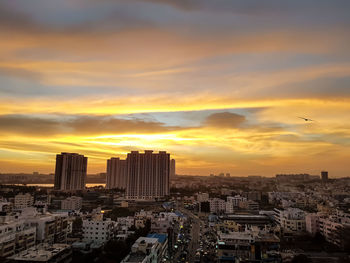 High angle view of city at sunset