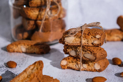 Traditional italian cantuccini cookies with almonds in glass jar. sweet dried biscuits. homemade 