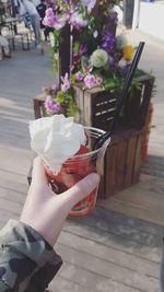 Close-up of hand holding ice cream