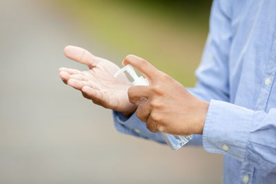 Close-up of man holding hands