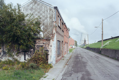 Street amidst buildings against sky