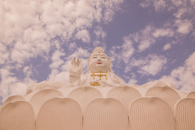 Low angle view of statue against sky