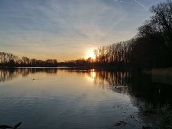 Scenic view of lake against sky during sunset