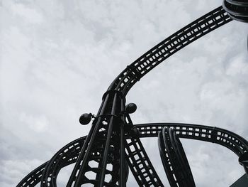 Low angle view of rollercoaster against sky