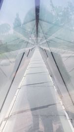 Reflection of sky on glass of airplane