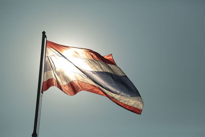 Low angle view of flag against clear sky