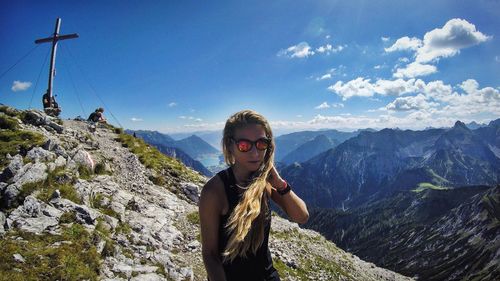 Portrat of woman with mountains in background