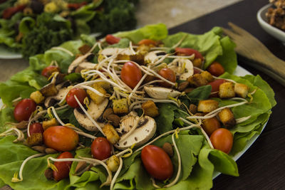 Close-up of chopped fruits in plate on table