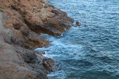 High angle view of rock formation at sea