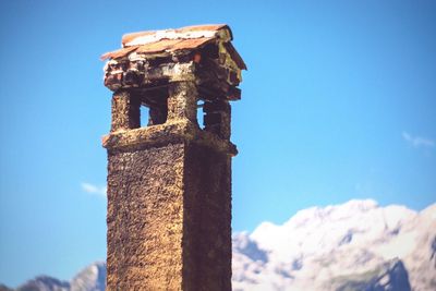 Low angle view of built structure against blue sky