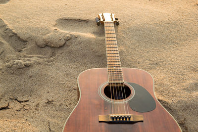 High angle view of guitar on beach