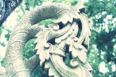 Close-up of statue against plants