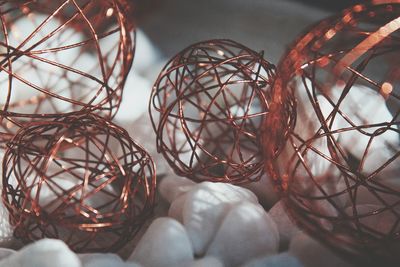 Close-up of metal decorations on pebbles