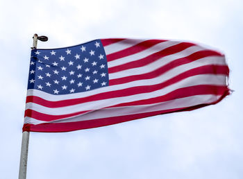 Low angle view of flag against sky