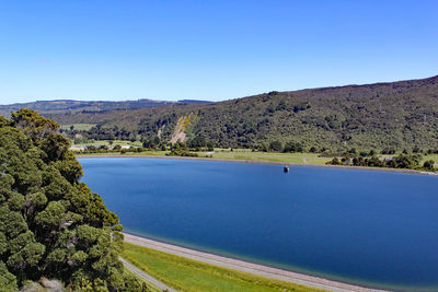 Scenic view of landscape against clear blue sky