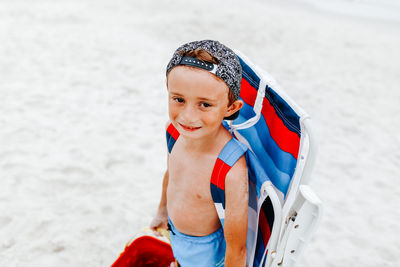 Portrait of happy boy on beach