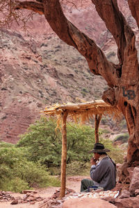 Man sitting on rock