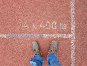 Low section of man standing on floor