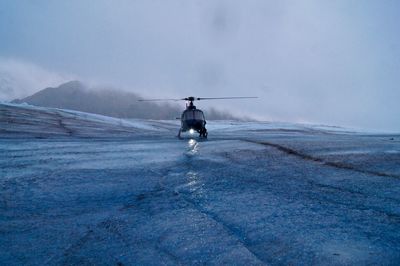 Helicopter atop the mendenhall glacier - ready for take off in the foggy mist.