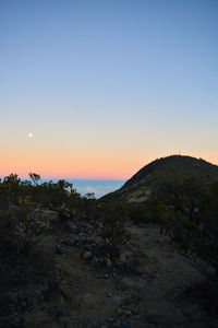 Scenic view of sea against clear sky during sunset