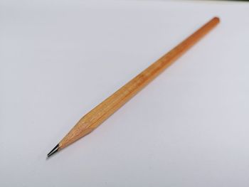 Close-up of colored pencils against white background