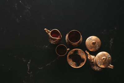 Close-up of coffee cup against black background